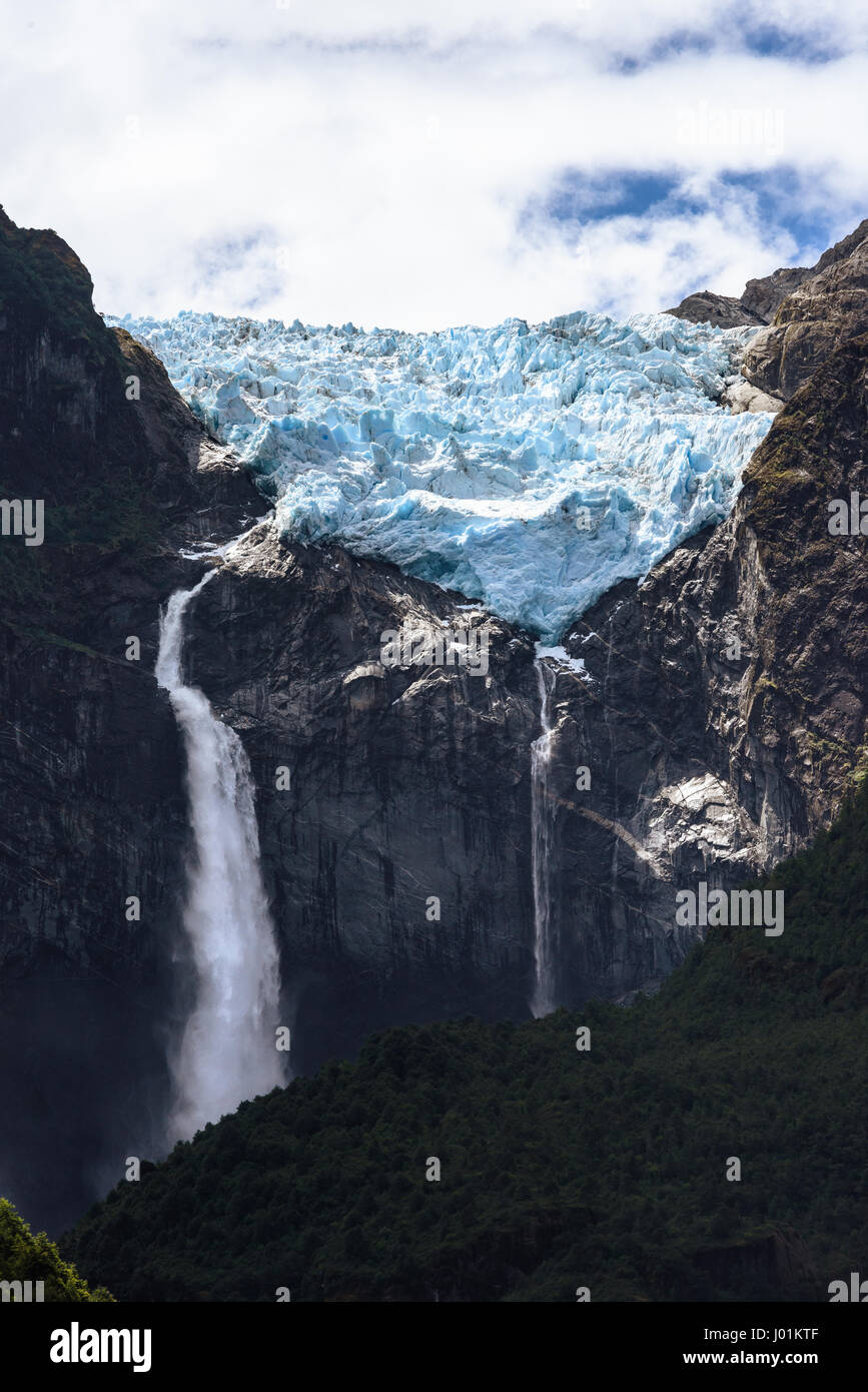 The Hanging Glacier in Queulat National Park in Southern Chile is the tip of a small ice field that terminates at the edge of a mountain ridge. Stock Photo