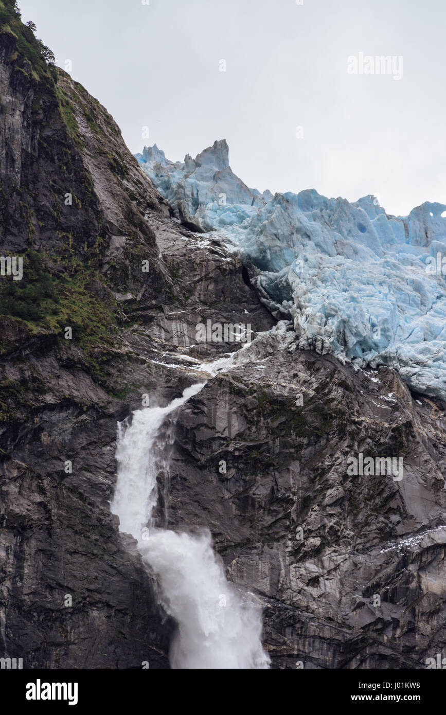 The Hanging Glacier in Queulat National Park in Southern Chile is the tip of a small ice field that terminates at the edge of a mountain ridge. Stock Photo