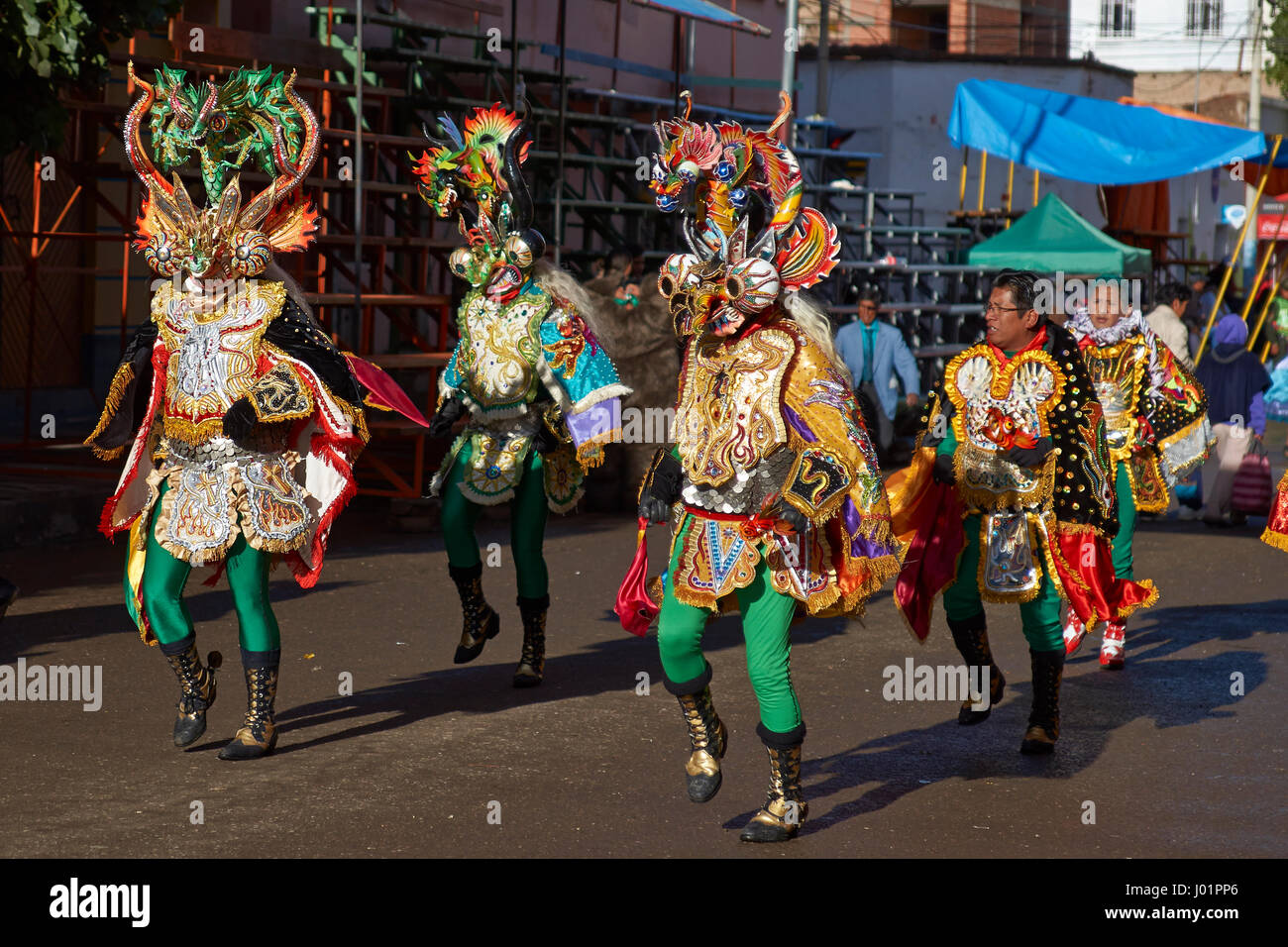 Masked Diablada dancers in ornate costumes parade through the mining city of Oruro on the Altiplano of Bolivia during the annual carnival. Stock Photo