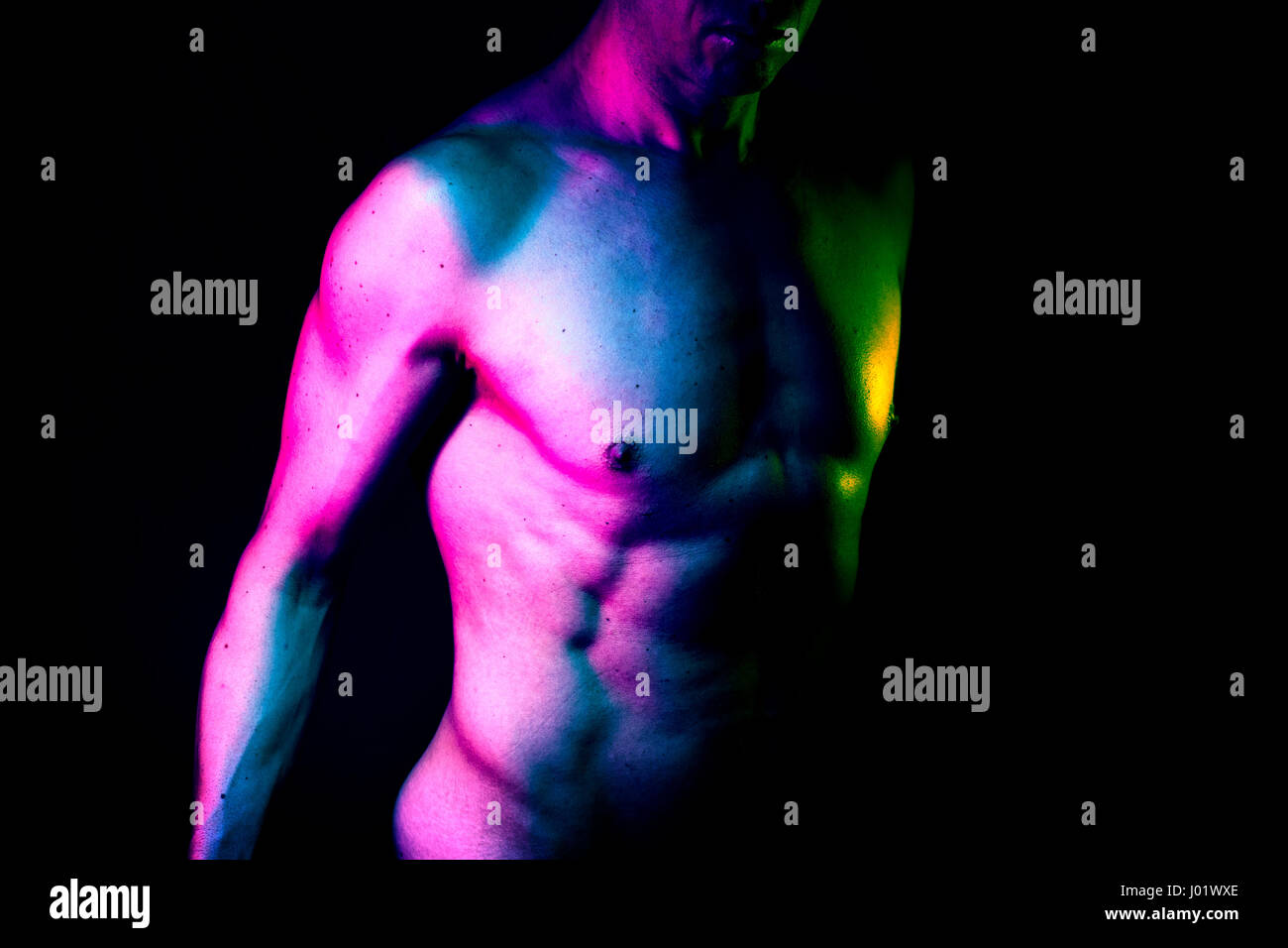 Sexy male nude slim athletic man with naked torso, chest and abs. Toned athletic physique with