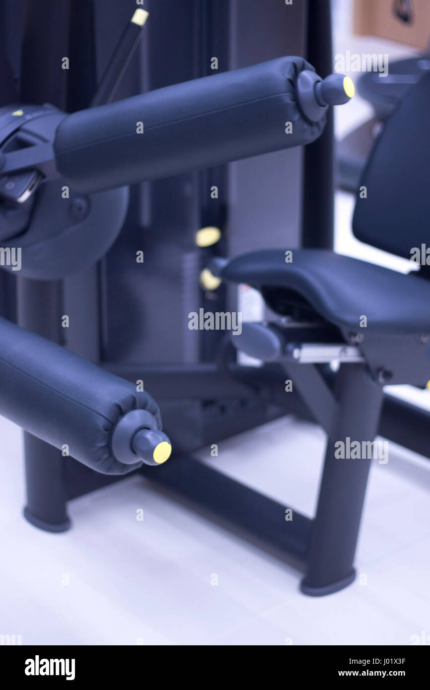 Leg weights extension for quadriceps and curl for hamstrings gym