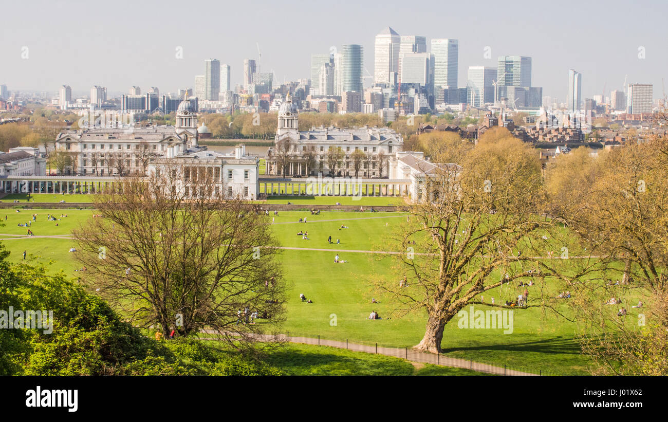 View from Greenwich Park over the University buildings towards the Canary Wharf skyscrapers in the background, London, England Stock Photo