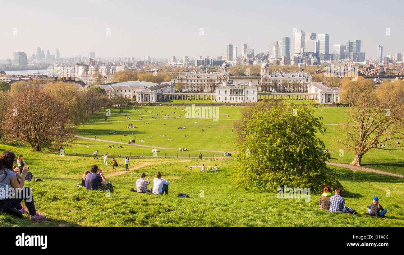 View from Greenwich Park over the University buildings towards the Canary Wharf skyscrapers in the background, London, England Stock Photo