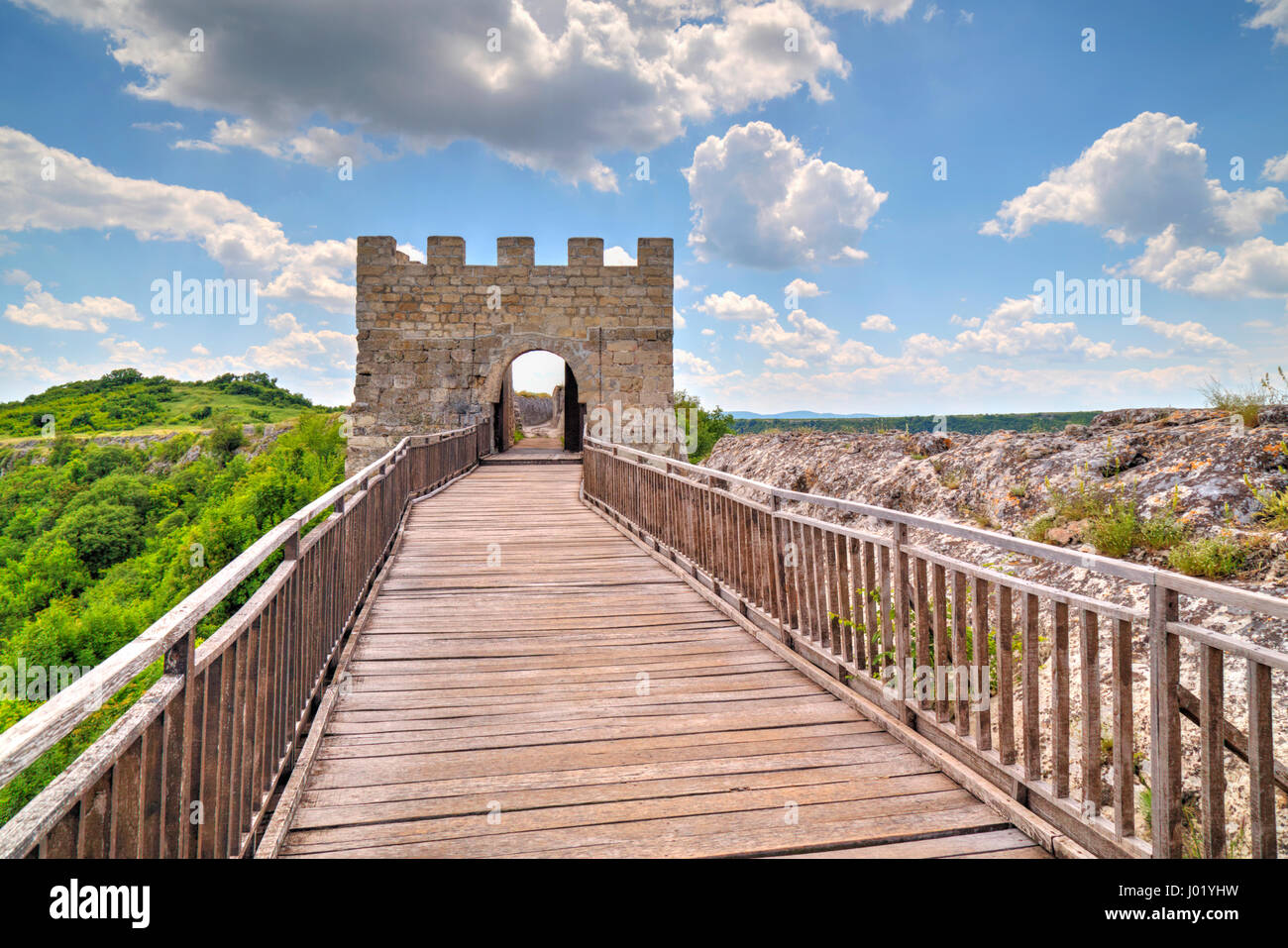 Stone walls and gate with wooden bridge of medieval fortress Stock ...