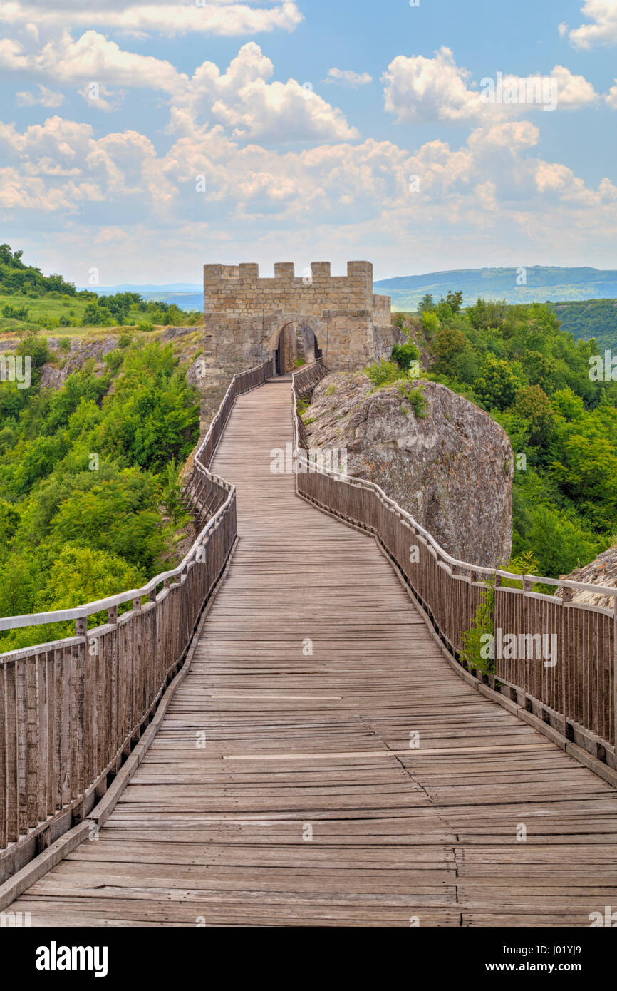 Stone walls and gate with wooden bridge of medieval fortress Stock ...
