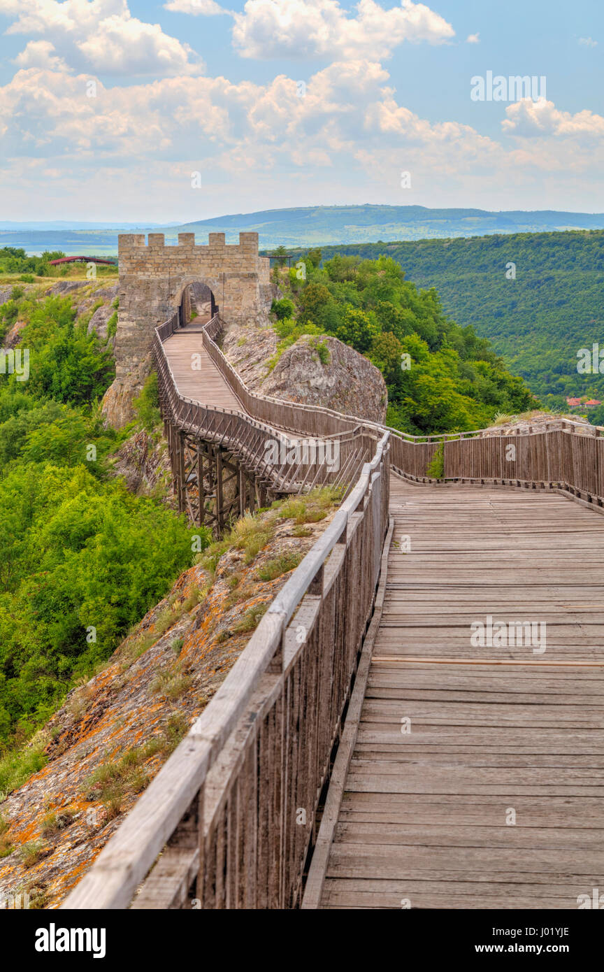 Stone walls and gate with wooden bridge of medieval fortress Stock ...