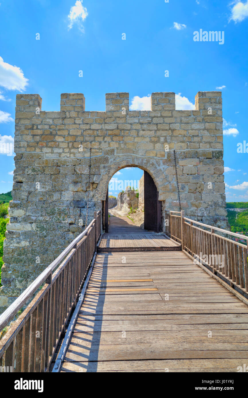 Stone walls and gate with wooden bridge of medieval fortress Stock ...