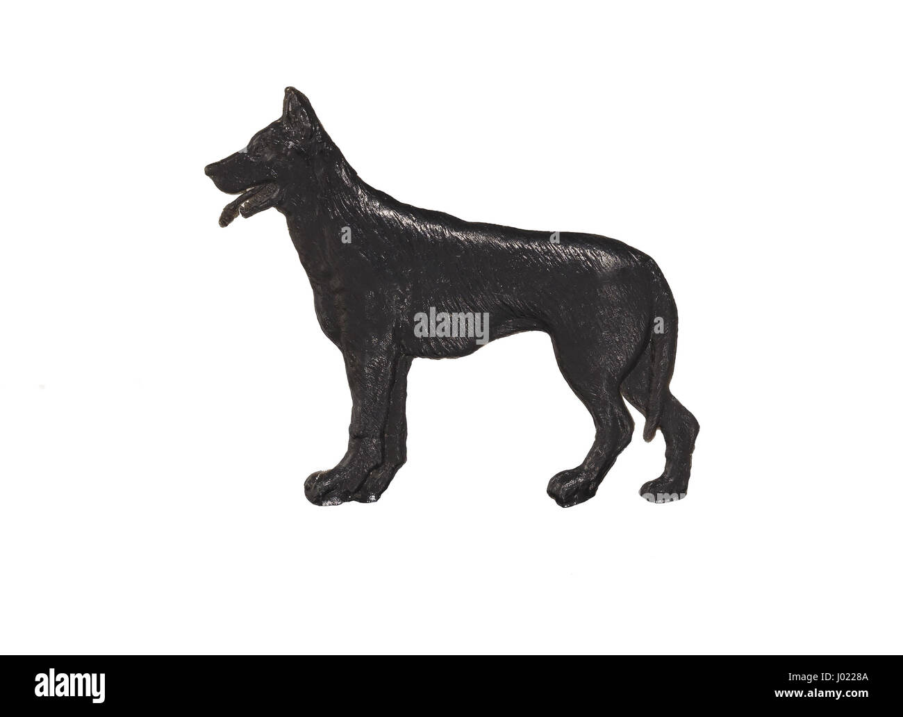 Black dog figure on white background, German Shepherd Stock Photo