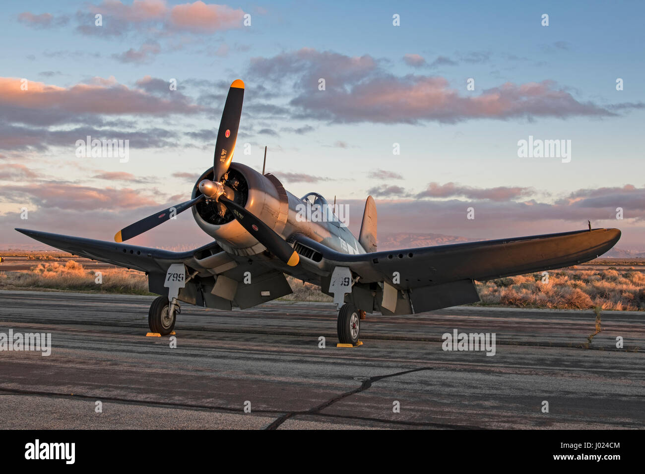 Airplane WWII F-4U Corsair vintage fighter aircraft at air show runway Stock Photo