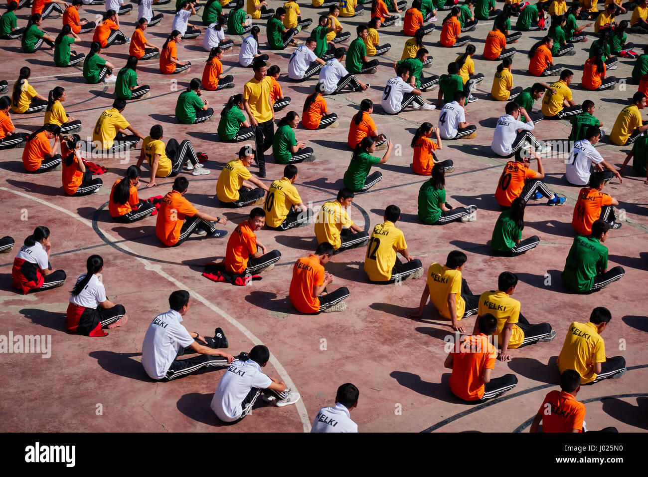 Students from Kelki school in Thimphu Bhutan participate in outdoor group exercise Stock Photo