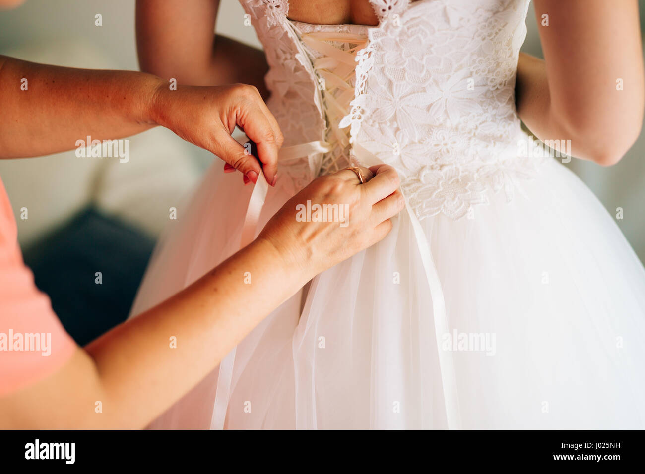 Mom Button Up The Bride S Dress Dressing Up A Wedding Dress Stock