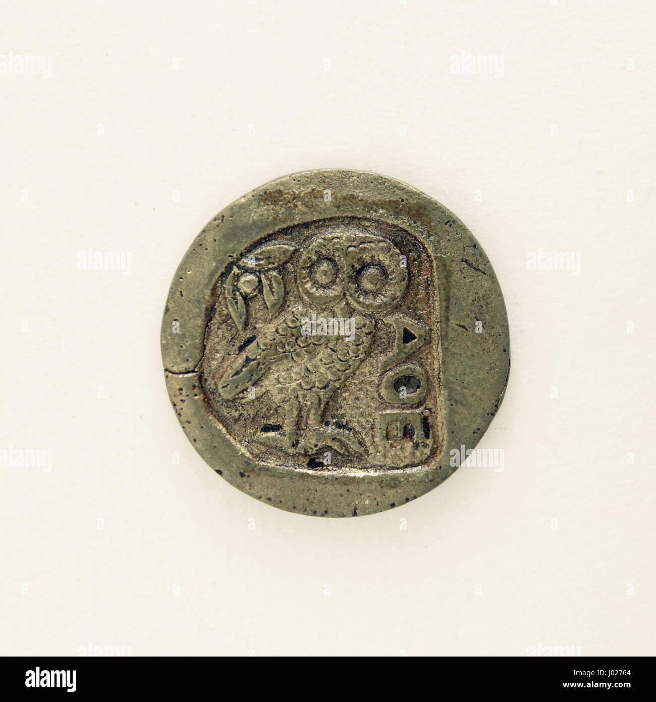 Reverse of Tetradrachm silver coin from after 499 BCE. Owl of Athena and olive branch. Metal copy. Reproduction. Stock Photo