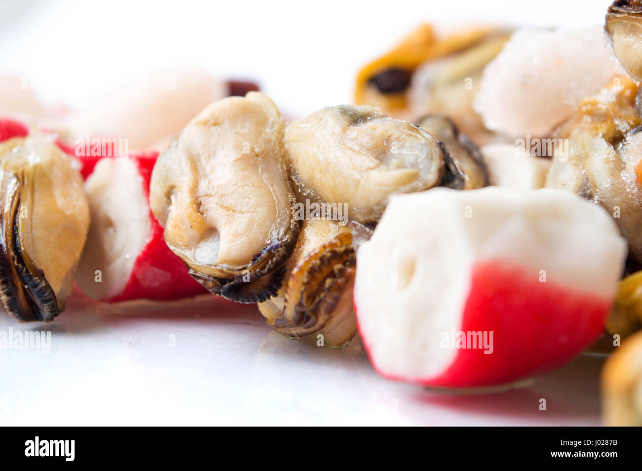 Frozen seafood mix of shrimps, surimi mussels and octopus Stock Photo