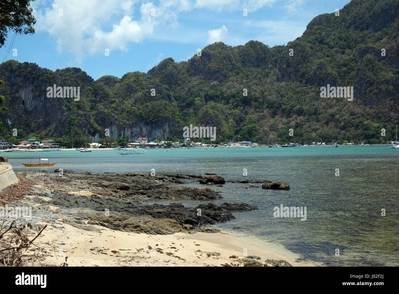 View Of El Nido Palawan With Houses And Mountains Stock Photo
