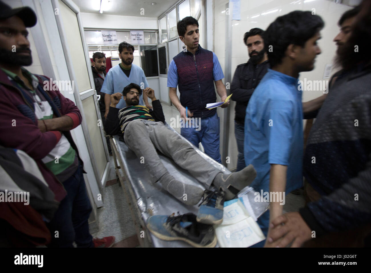Srinagar, Indian-controlled Kashmir. 9th Apr, 2017. Paramedics transfer a wounded person inside a hospital in Srinagar, summer capital of Indian-controlled Kashmir, April 9, 2017. At least three persons were killed and several others injured on Sunday when Indian security forces opened fire on a stone-pelting mob that stormed a polling station in Indian-controlled Kashmir's parliamentary constituency of Srinagar. Credit: Javed Dar/Xinhua/Alamy Live News Stock Photo