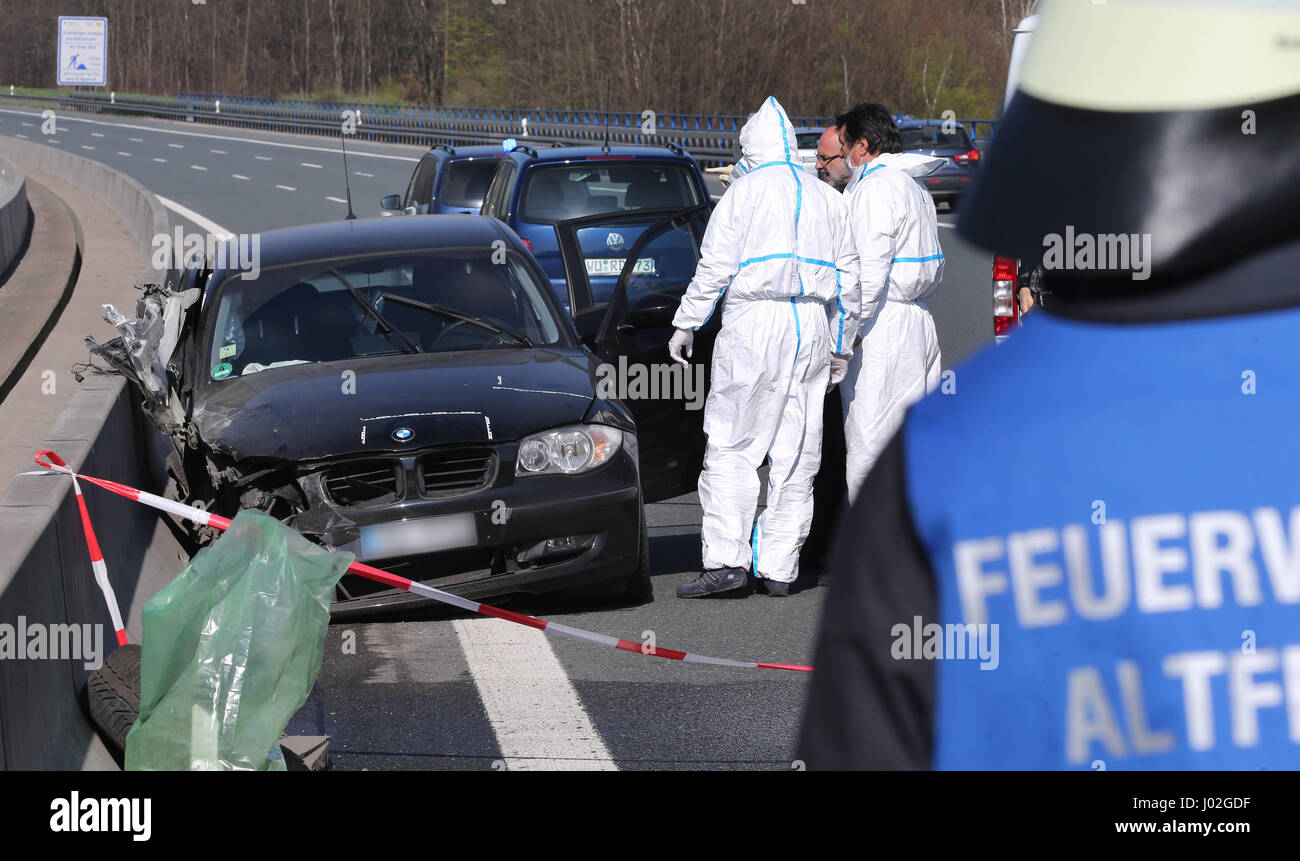 Bischbrunn, Germany. 09th Apr, 2017. Police investigators secure traces on car on the Haseltalbruecke bridge of the A3 highway at Bischbrunn, Germany, 09 April 2017. Inside the car the body of a woman was found, under the bridge a dead man. The police suspect a domestic relationship incident. Photo: Karl-Josef Hildenbrand/dpa/Alamy Live News Stock Photo