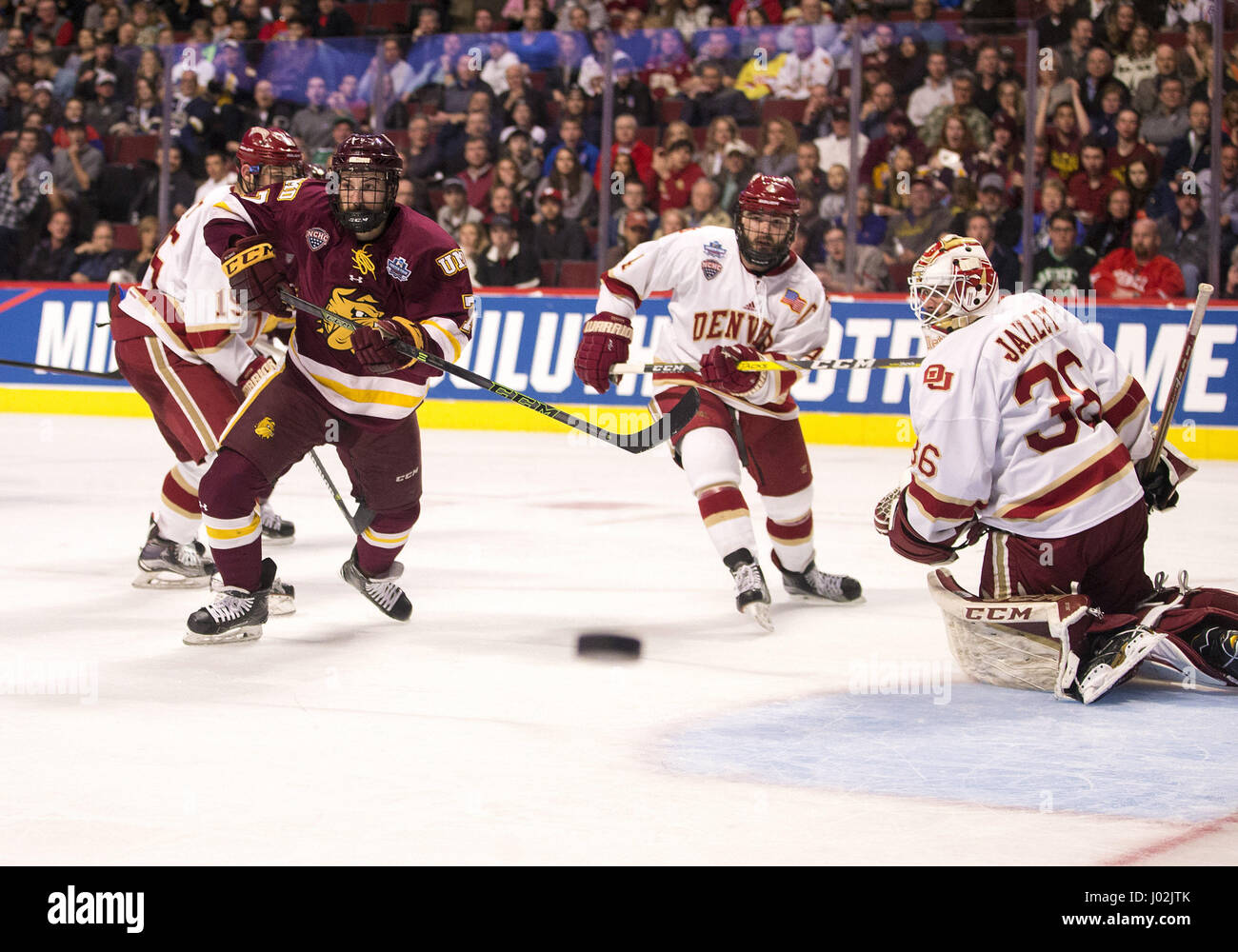 Chicago, Illinois, USA. 08th Apr, 2017. Minnesota Duluth forward Adam Johnson (7) and Denver