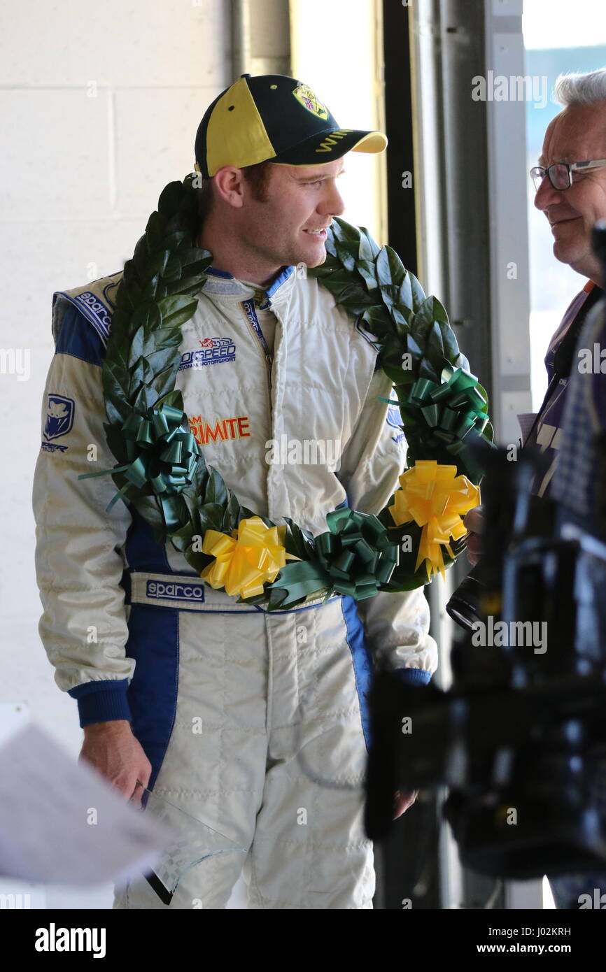 Silverstone, United Kingdom. 9th Apr, 2017. James Gornall talks to media and his team following his victory in the Silverstone race for the BMW Compact Cup during the BRSCC Race Meeting Stock Photo