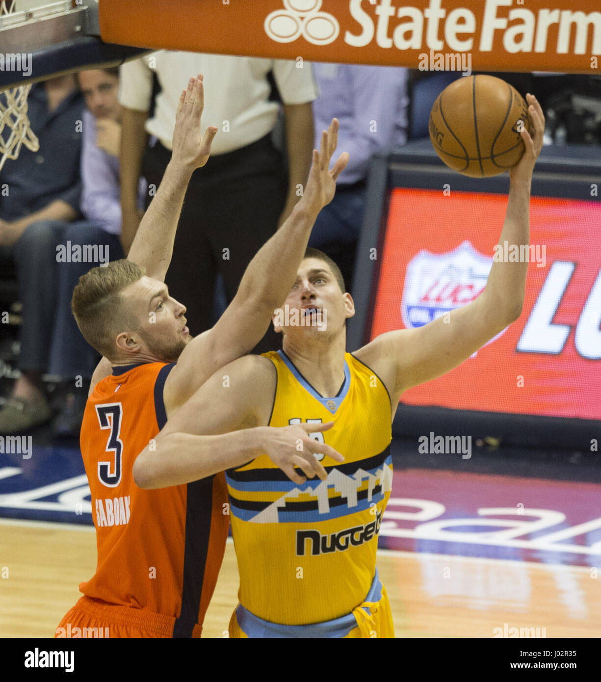 Denver, Colorado, USA. 9th Apr, 2017. Nuggets NIKOLA JOKIC, right, makes a drive to the basket with Thunder's DOMANTAS SABONIS, left, during the 2nd. Half at the Pepsi Center Sunday afternoon. The Thunder beats the Nuggets 106-105. Credit: Hector Acevedo/ZUMA Wire/Alamy Live News Stock Photo