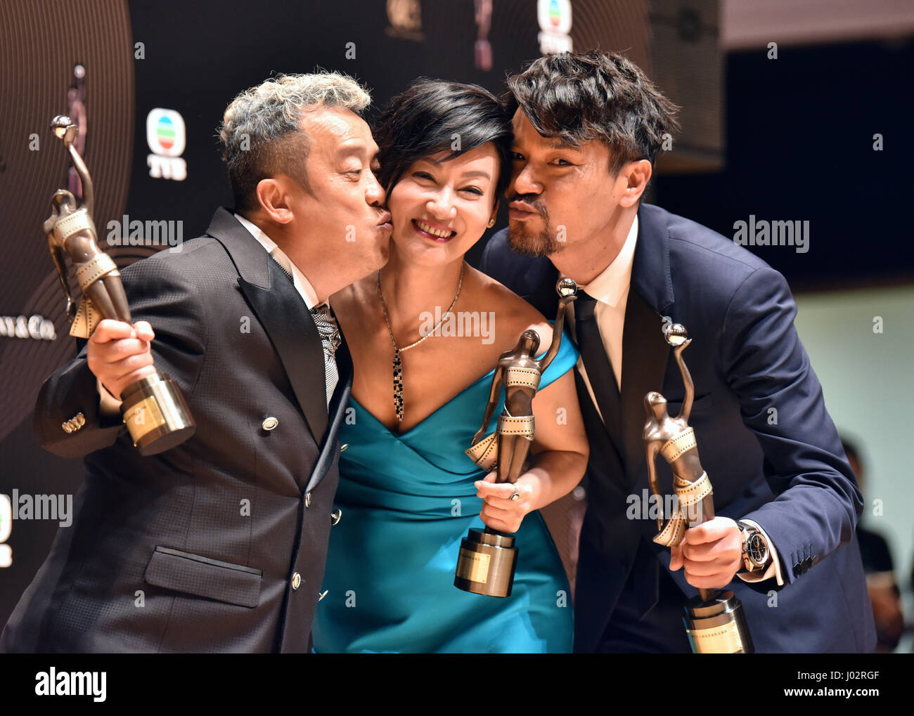 Hong Kong, China. 9th Apr, 2017. Actors Lam Ka Tung (1st R), Kara Wai (C) and Eric Tsang pose when meeting the press after the 36th Hong Kong Film Awards presentation ceremony in Hong Kong, south China, April 9, 2017. Lam Ka Tung won the Best Actor for film 'Trivisa', Kara Wai won the Best Actress for film 'Happiness', and Eric Tsang won the Best Supporting Actor for film 'Mad World'. Credit: Wang Xi/Xinhua/Alamy Live News Stock Photo