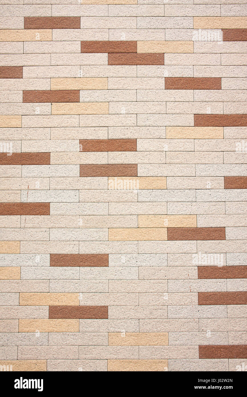 Brownish stone block of modern wall for background Stock Photo - Alamy