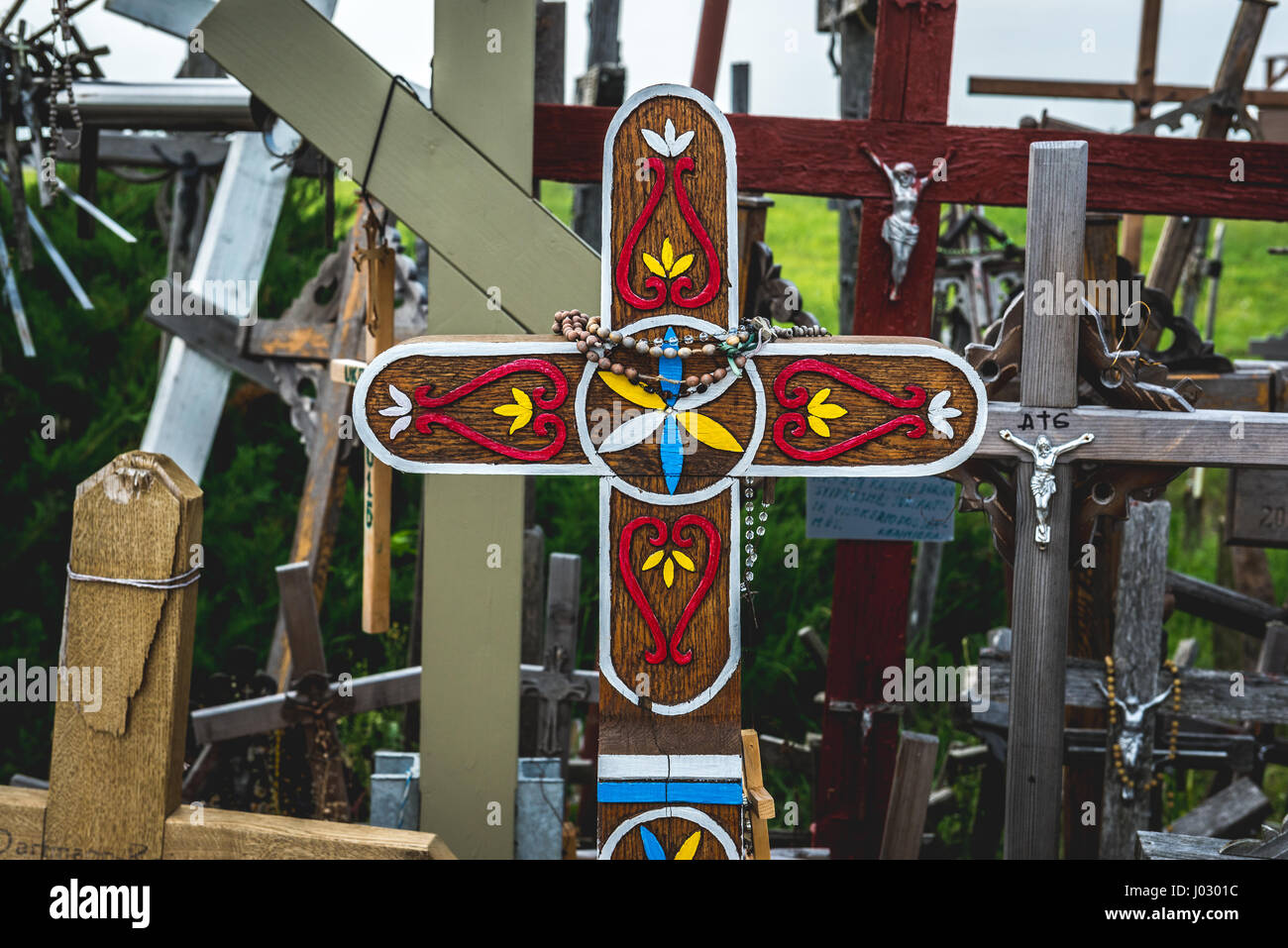 Decorated cross on Hill of Crosses in Lithuania Stock Photo