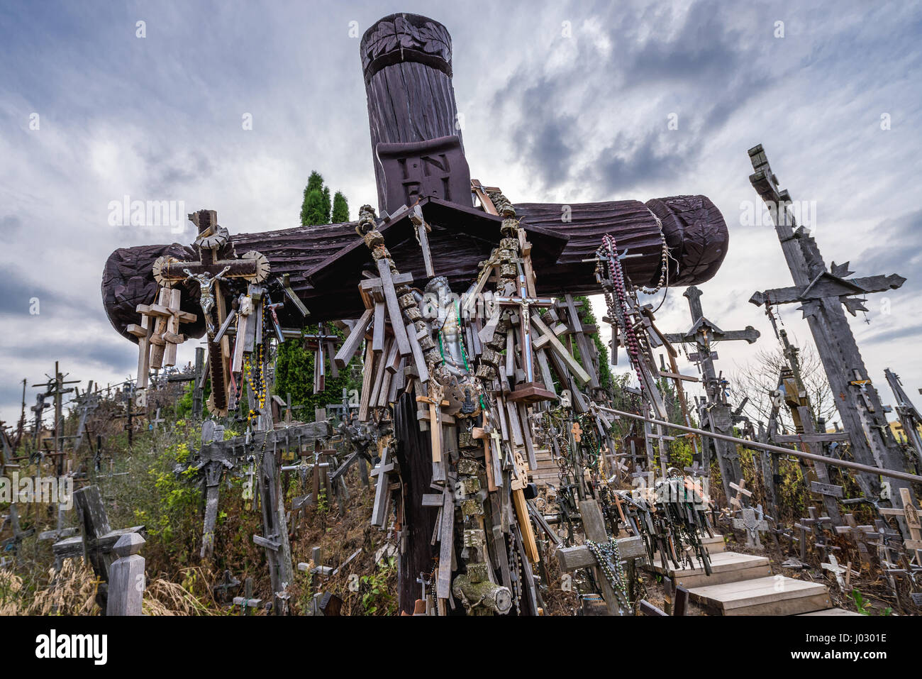 Large wooden cross on Hill of Crosses in Lithuania Stock Photo