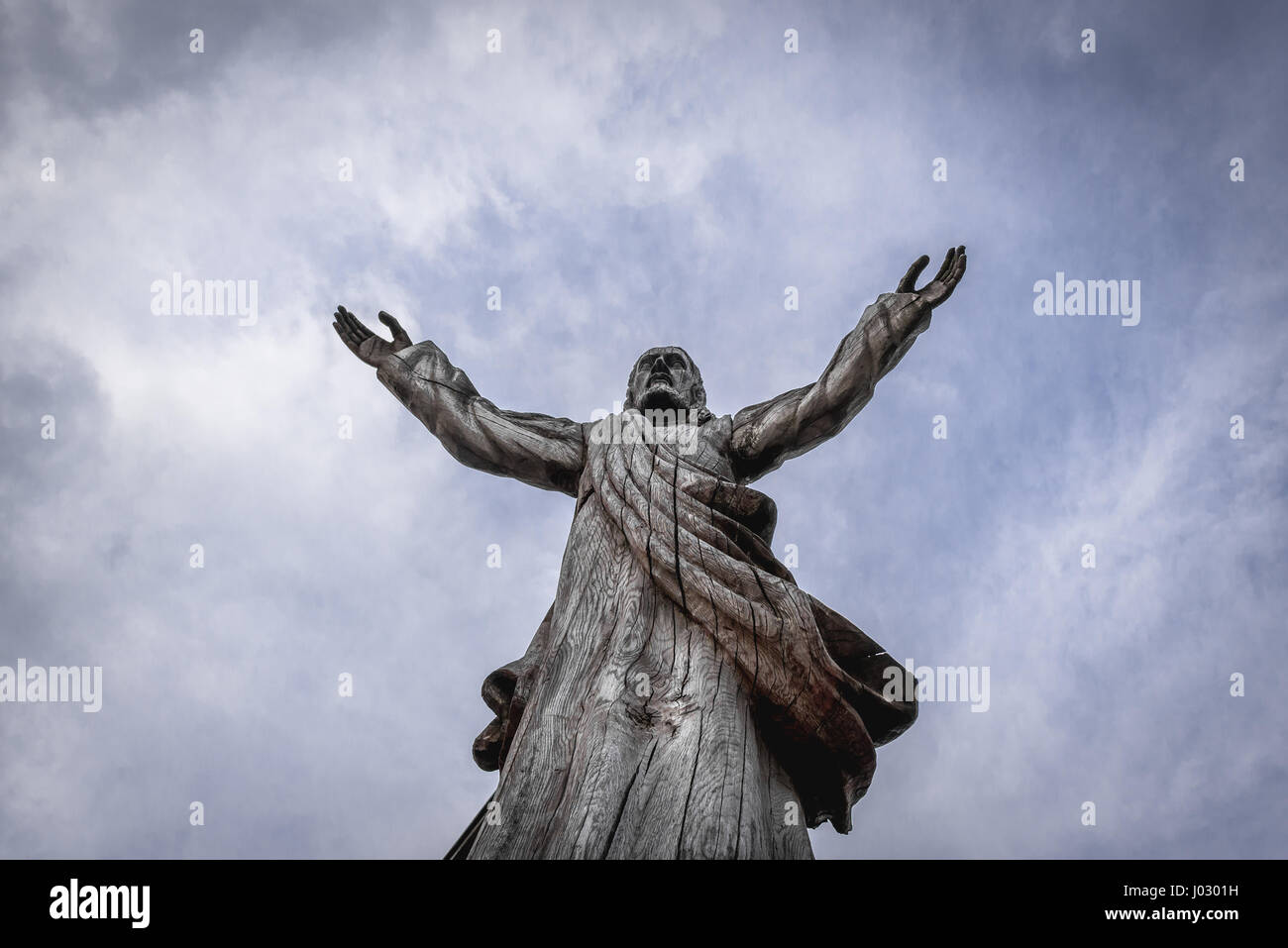Wooden statue of Jesus Christ on Hill of Crosses in Lithuania Stock Photo