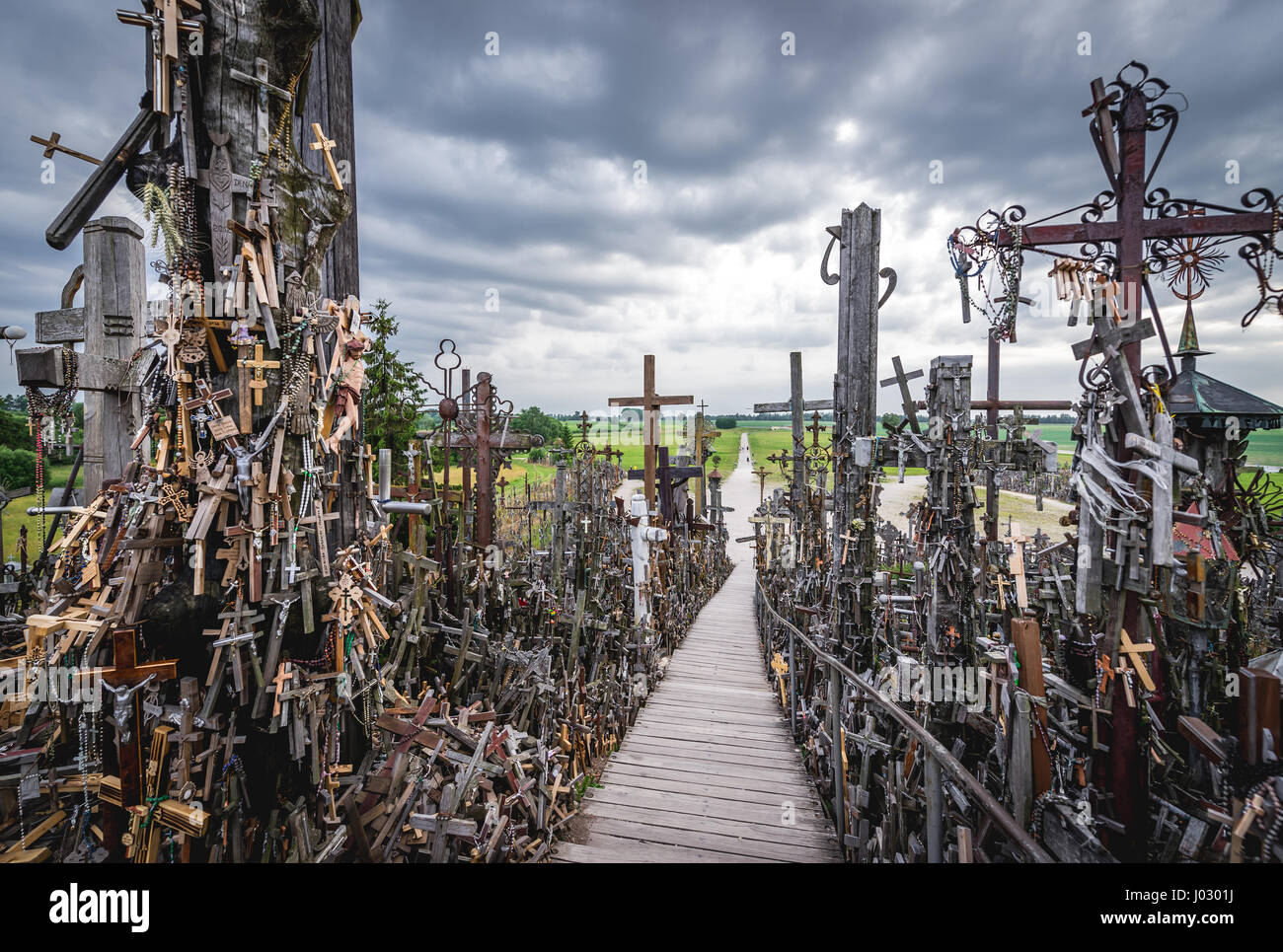 Wooden crosses and stairs to the top of Hill of Crosses in Lithuania Stock Photo