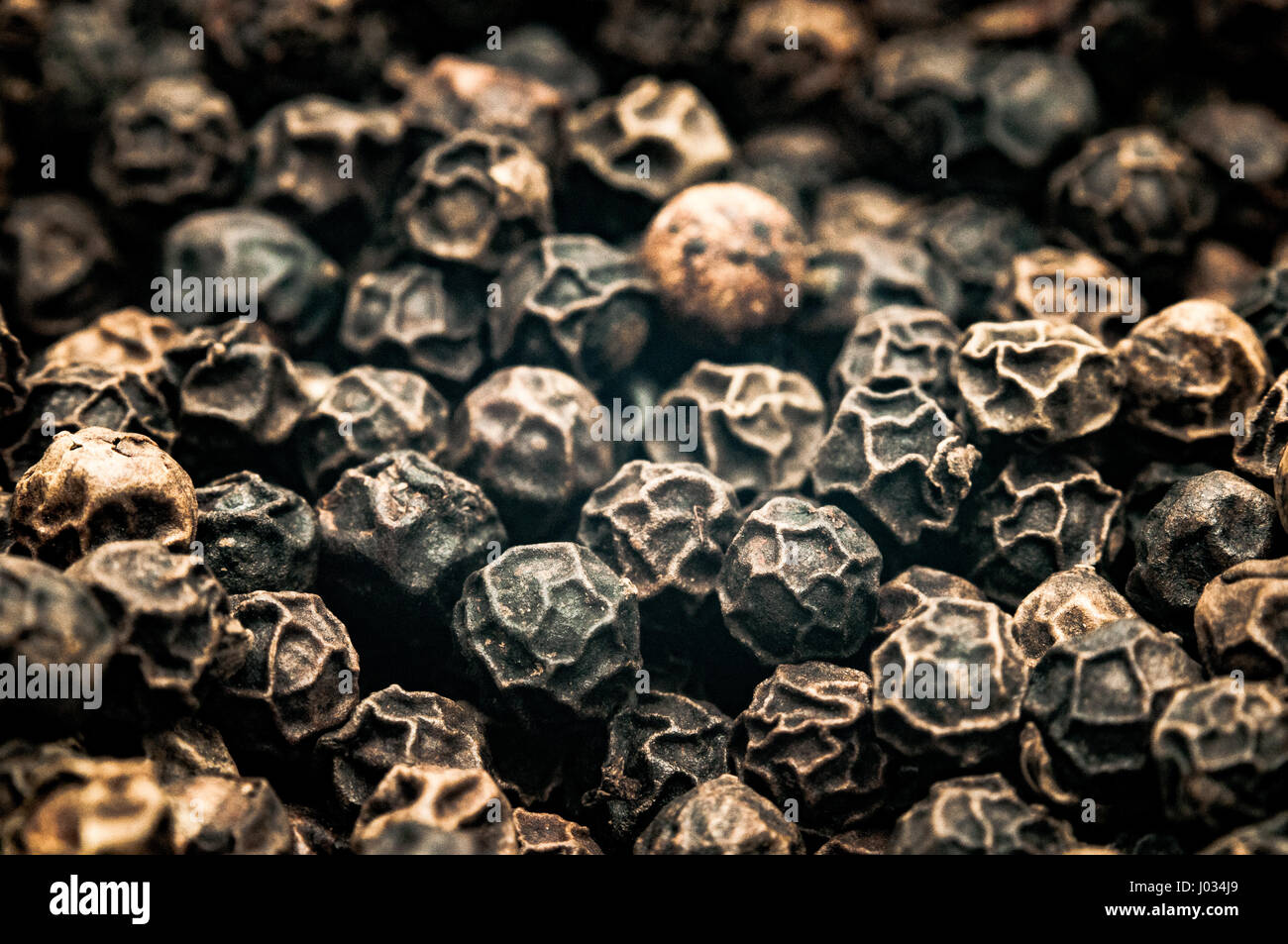 Extreme close-up  of black peppercorns Stock Photo