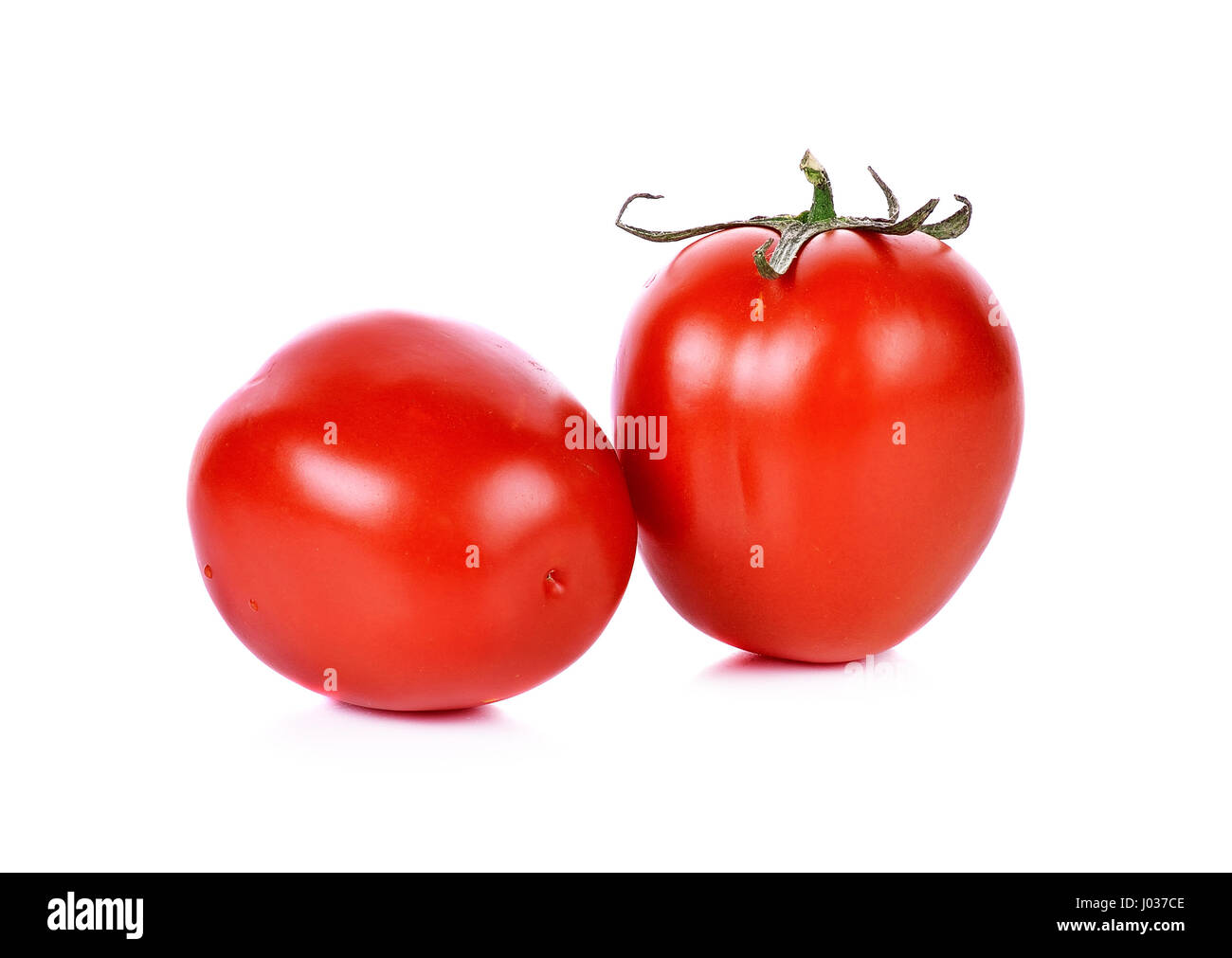 Tomatos isolated on white background Stock Photo - Alamy