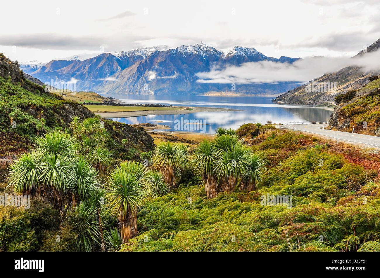 Clouds lying low over a lake near Wanaka in the Southern Lakes Region of New Zealand Stock Photo