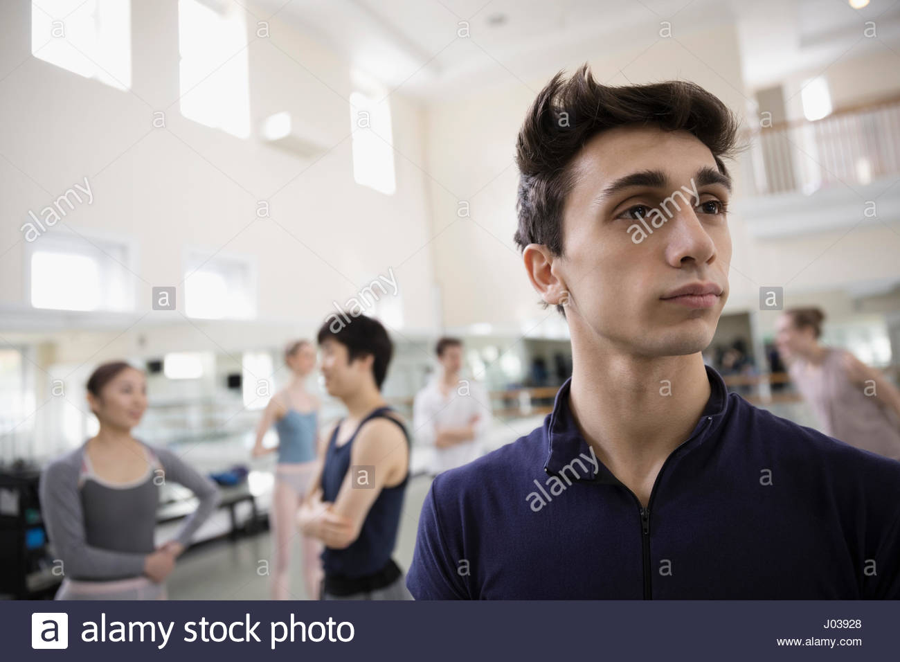 Portrait confident male ballet dancer looking away in dance studio