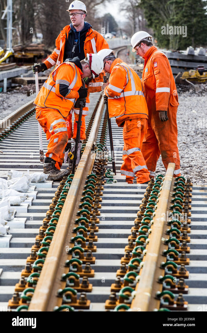 Rail construction workers installing new tracks and points Stock Photo