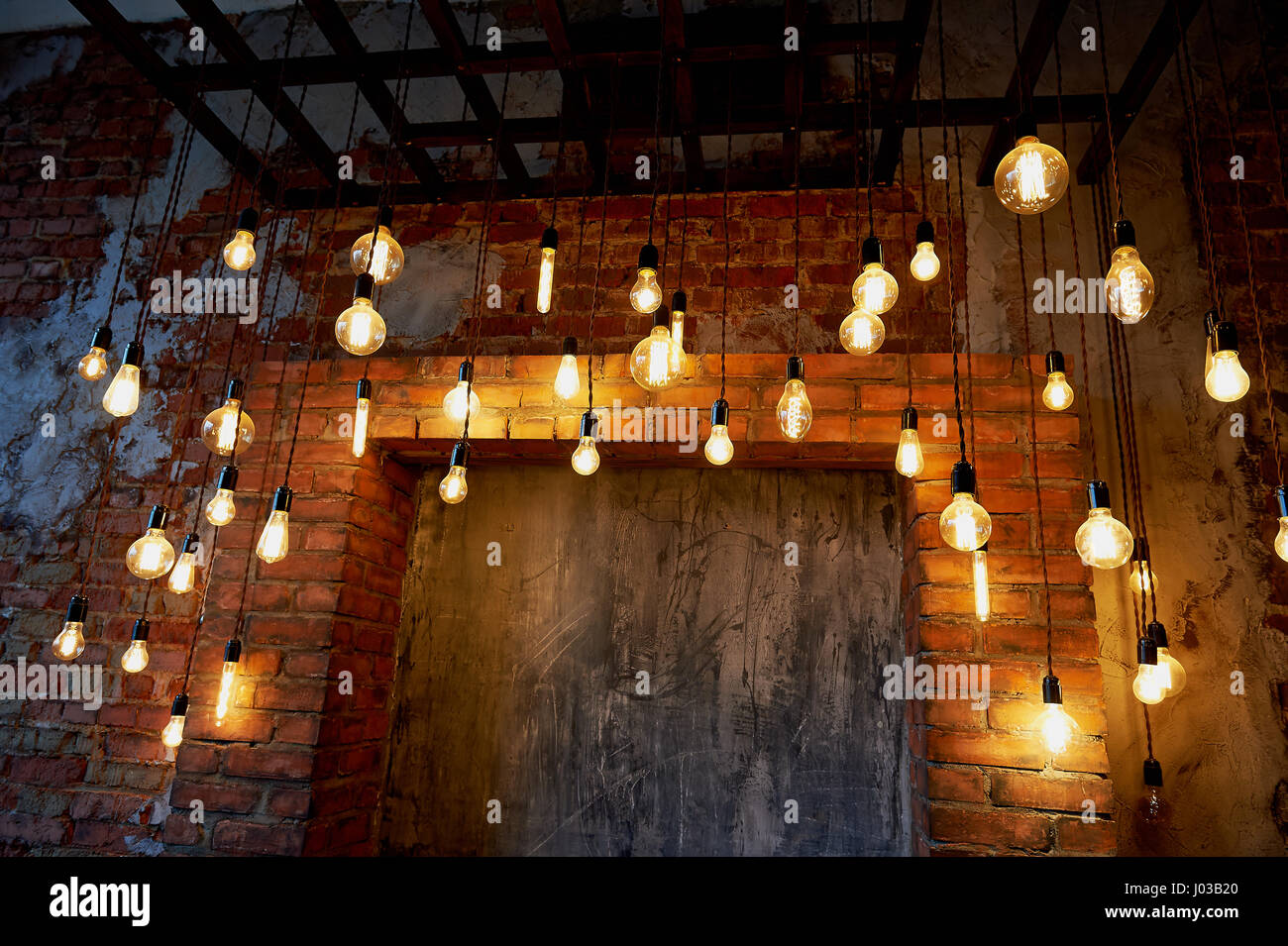 Edison light bulb hanging on a long wire. Cozy warm yellow light.Retro  Stock Photo - Alamy