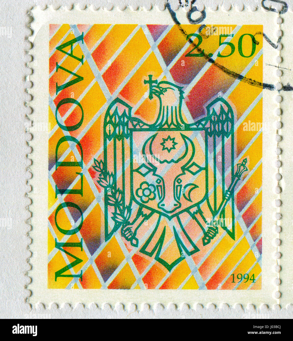 GOMEL, BELARUS, APRIL 7, 2017. Stamp printed in Moldova shows image of  The coat of arms Moldova, circa 1994. Stock Photo