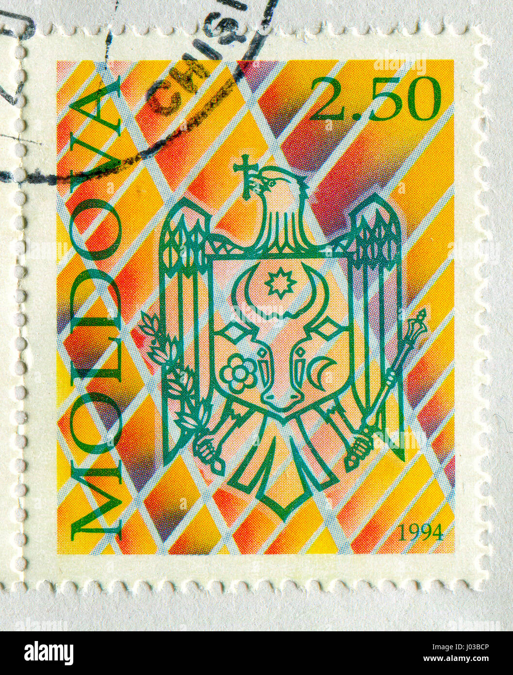 GOMEL, BELARUS, APRIL 7, 2017. Stamp printed in Moldova shows image of  The coat of arms Moldova, circa 1994. Stock Photo