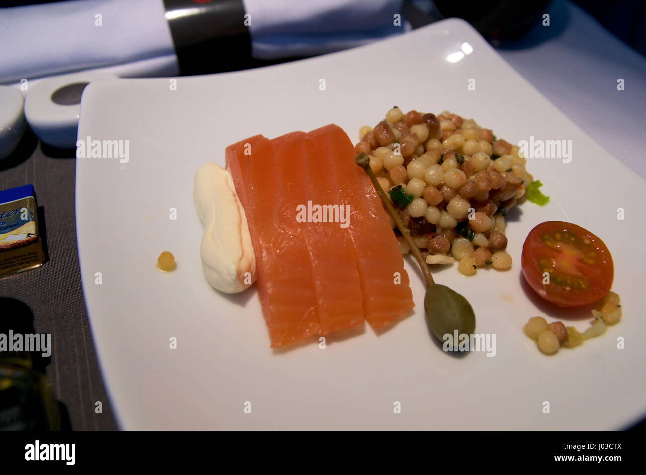 TORONTO, CANADA - JAN 21st, 2017: Air Canada Business Class in-flight meal, Smoked salmon with fregola salad as an appetizer Stock Photo