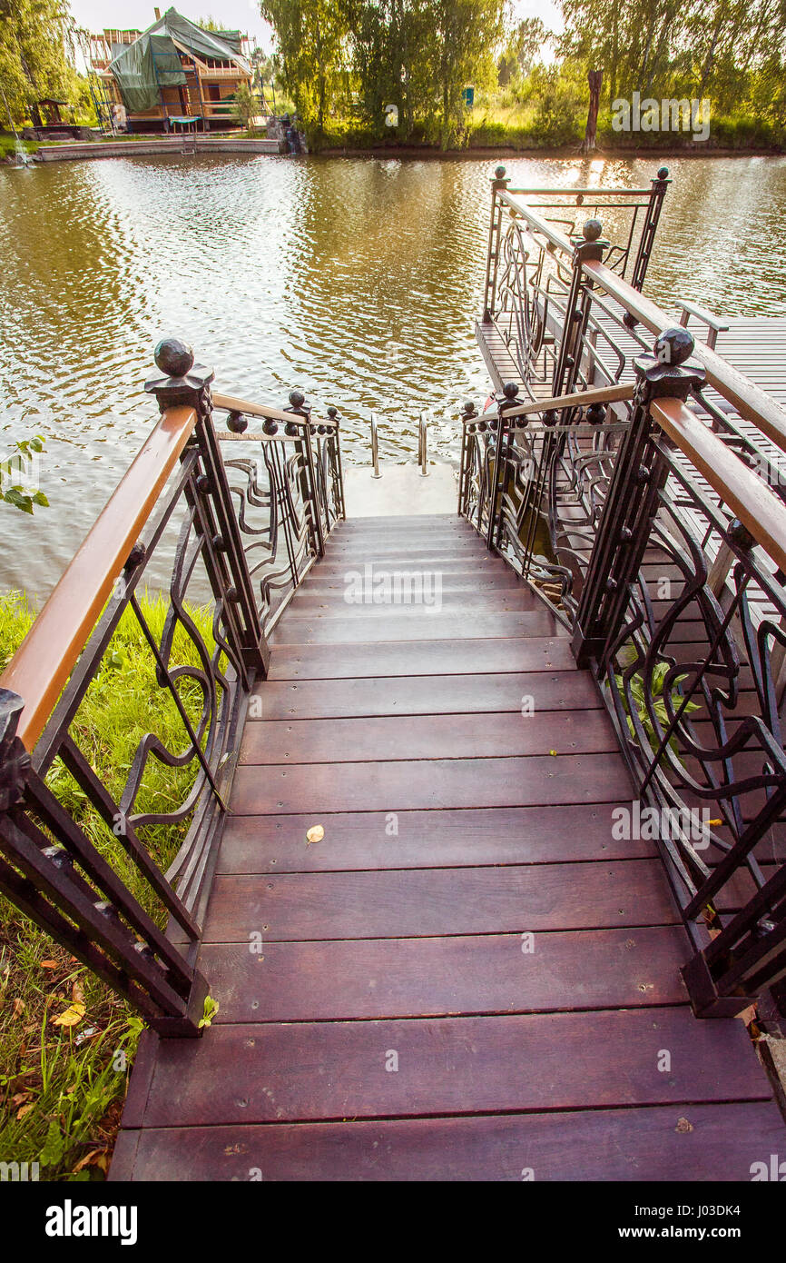 Pond with wooden pier Stock Photo