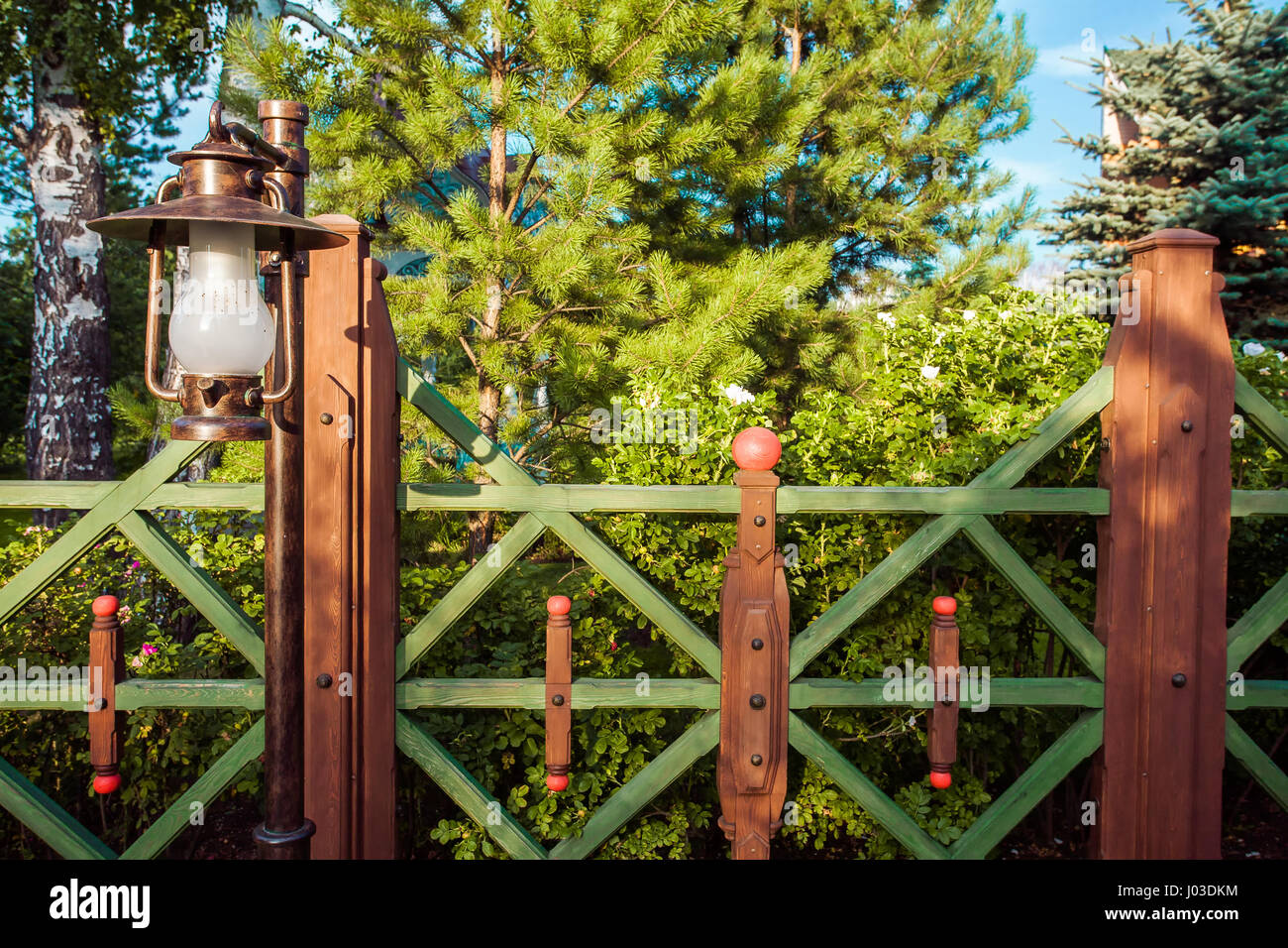 Vintage lantern and wooden fence Stock Photo - Alamy