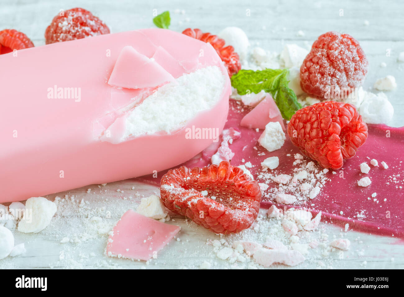 raspberries with ice cream in pink chocolate Stock Photo - Alamy