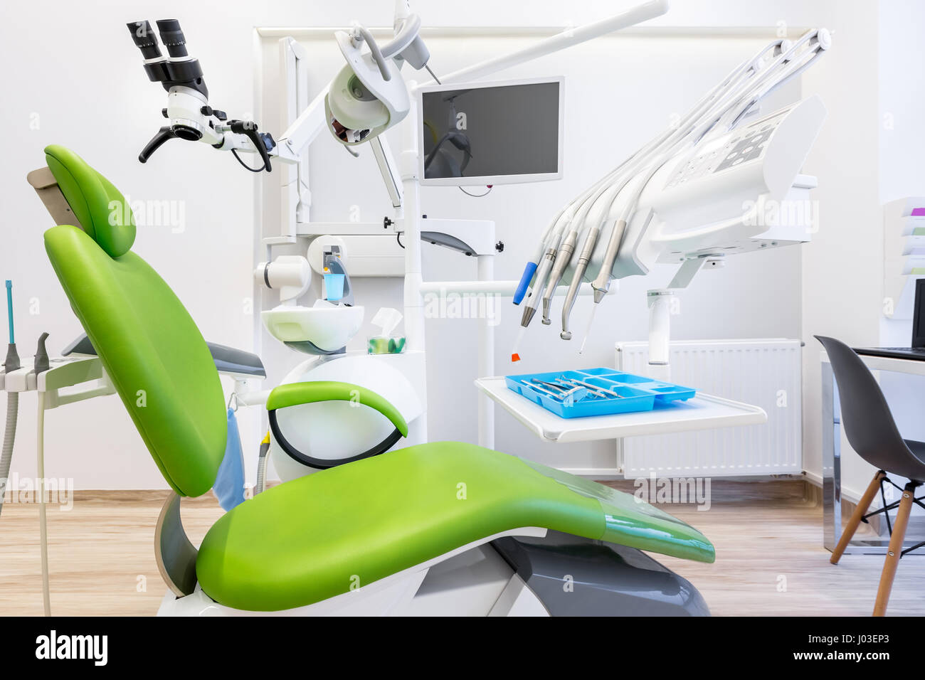 Modern Dental Office With Green Chair And Professional Tools Stock Photo Alamy