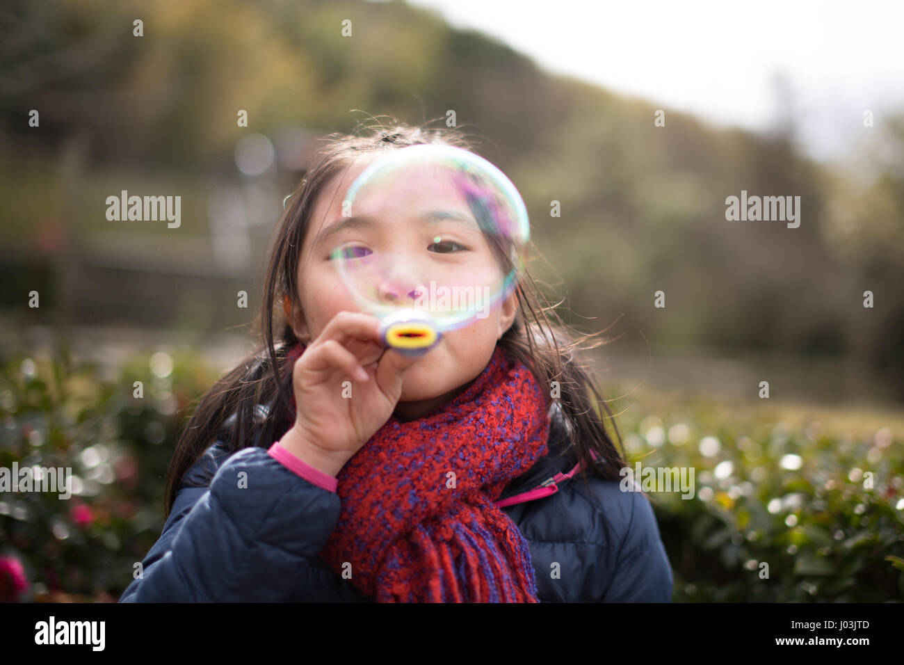 Playing soap bubble in the park Stock Photo - Alamy