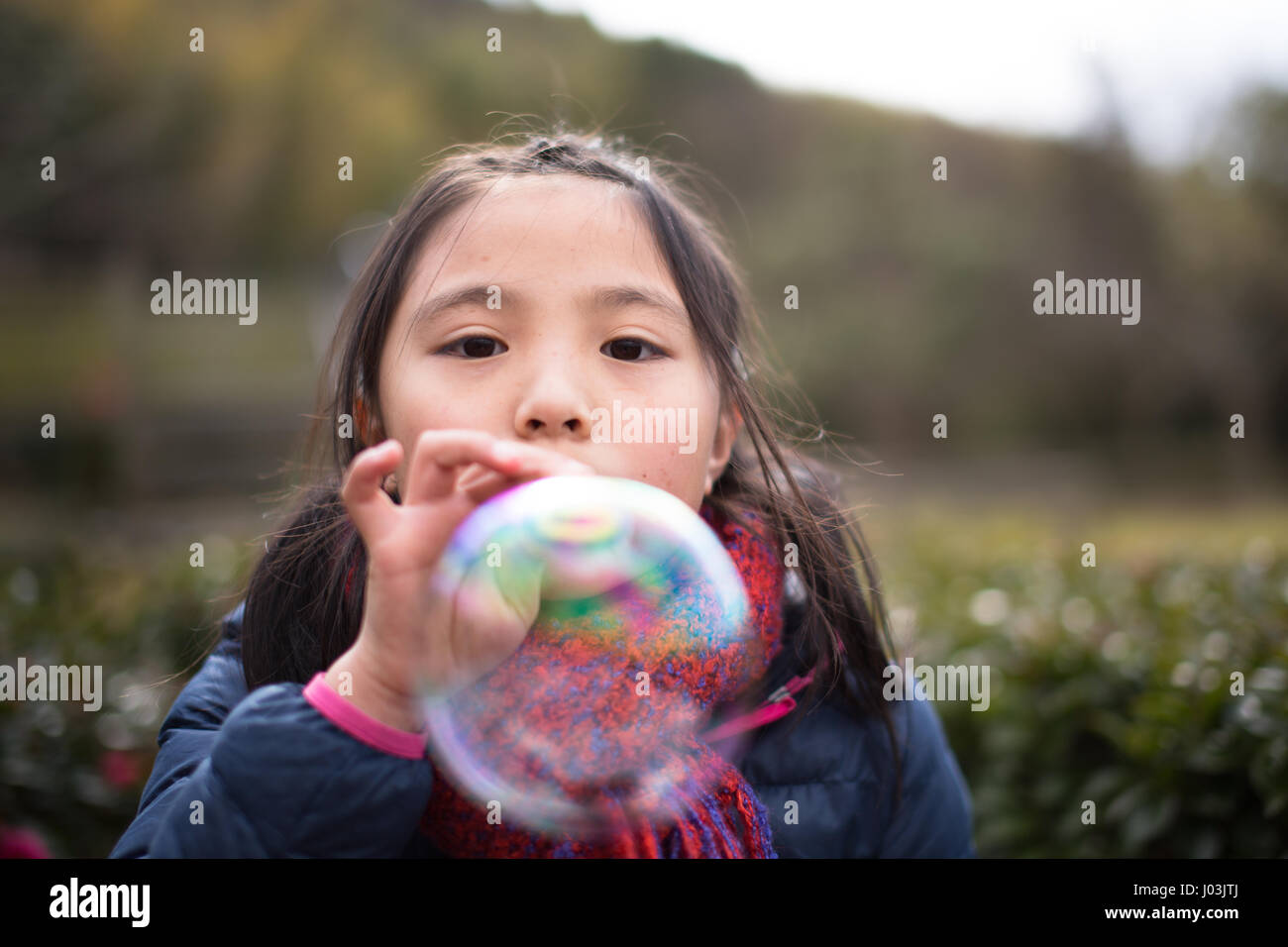 Playing soap bubble in the park Stock Photo - Alamy