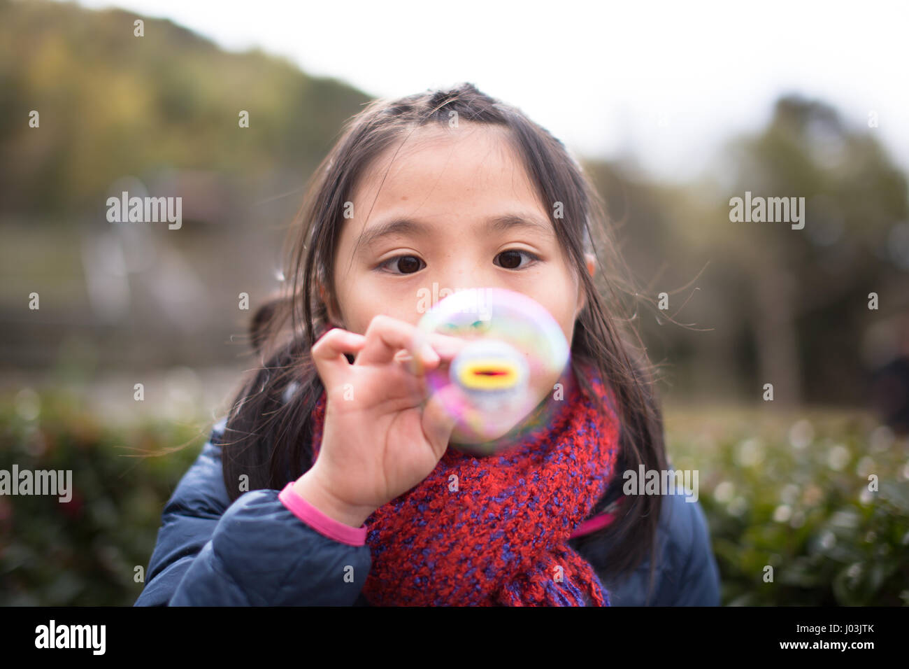 Playing soap bubble in the park Stock Photo - Alamy