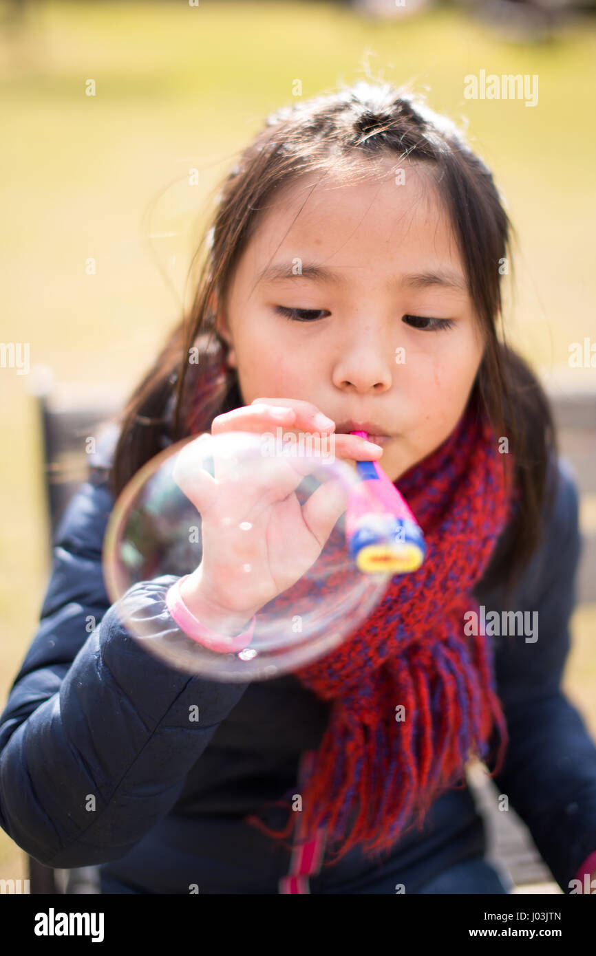 Playing soap bubble in the park Stock Photo - Alamy