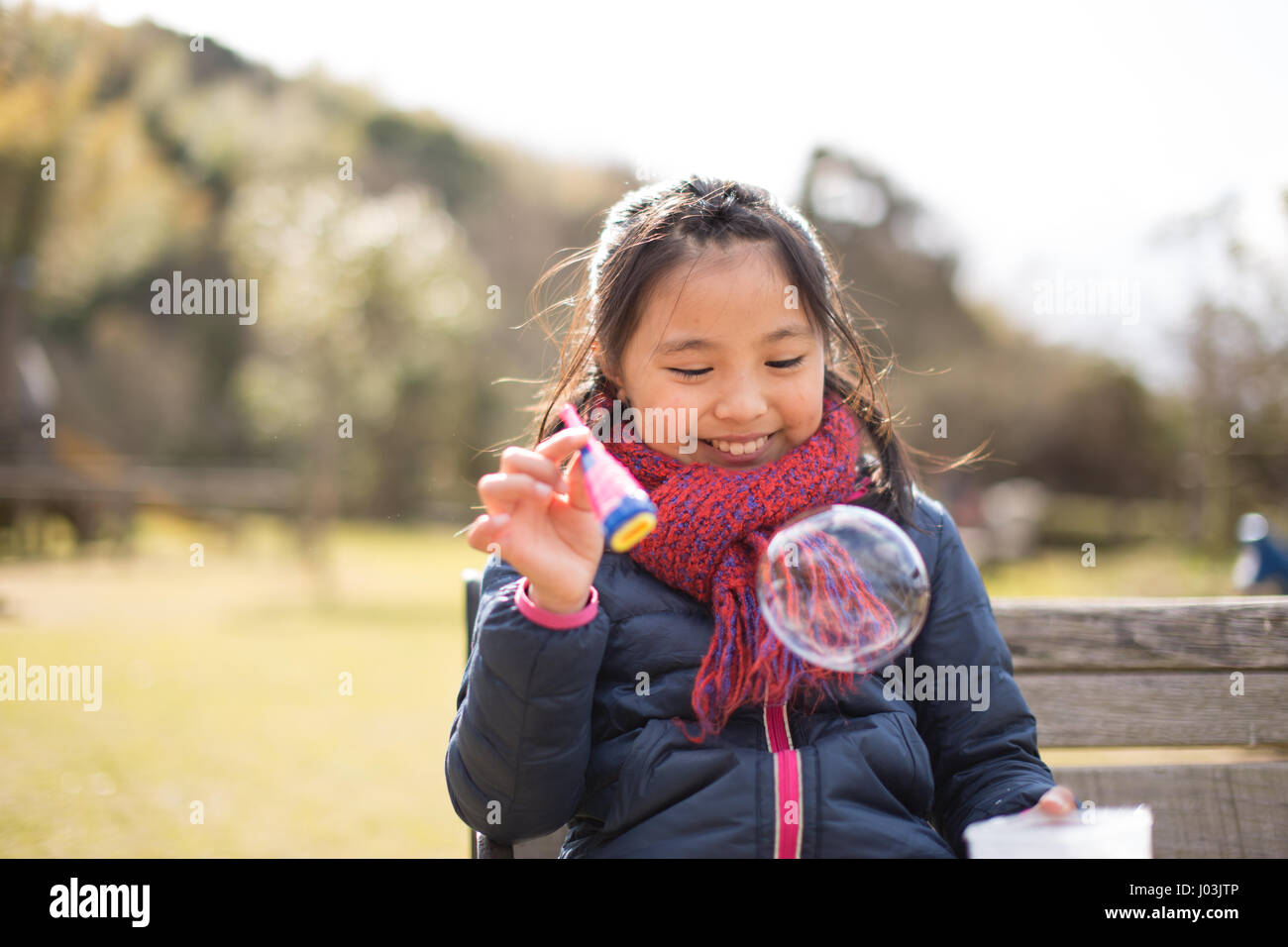 Playing soap bubble in the park Stock Photo - Alamy