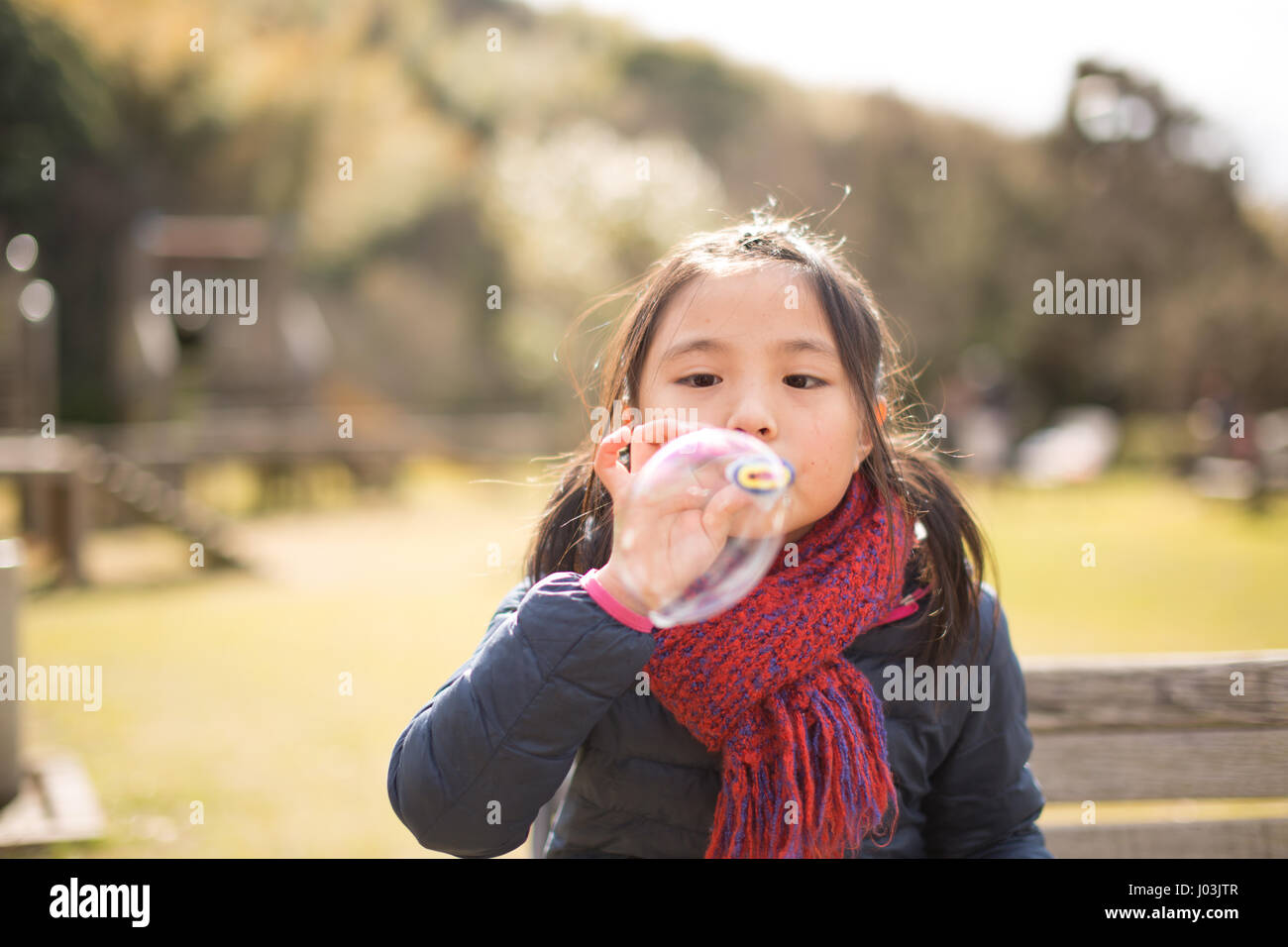 Playing soap bubble in the park Stock Photo - Alamy