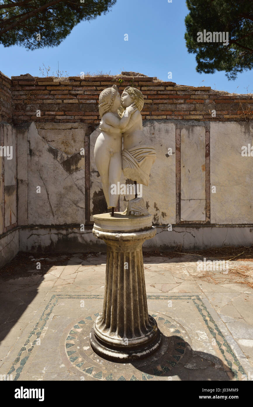 Rome. Italy. Ostia Antica. Statue of lovers embracing, House of Cupid and Psyche. Domus di Amore e Psiche. Stock Photo