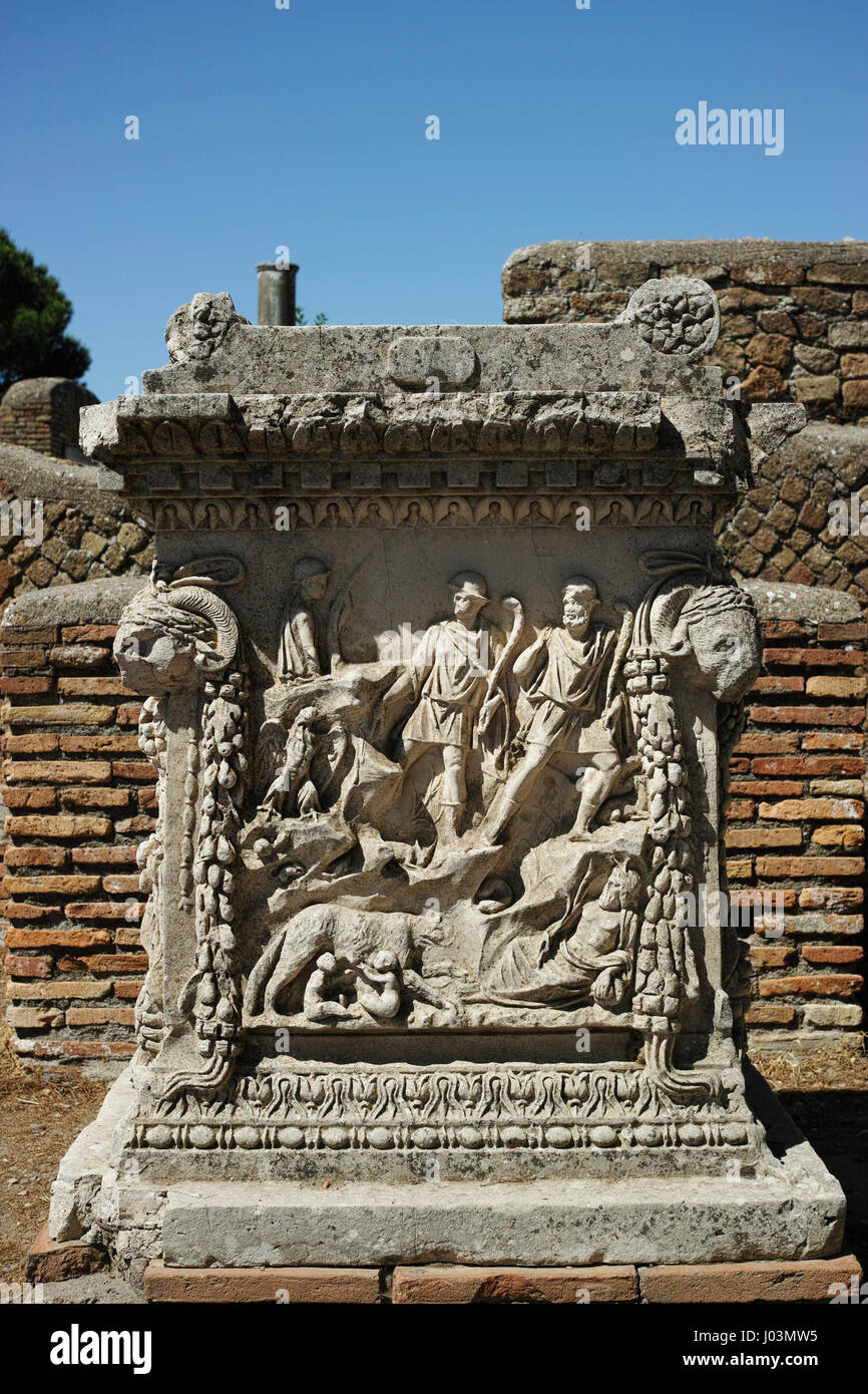 Rome. Italy. Ostia Antica. Sacellum. Altar of the Twins Romulus and Remus.  Relief depicting Cupid carrying the chariot of Mars (left) and Romulus and Stock Photo